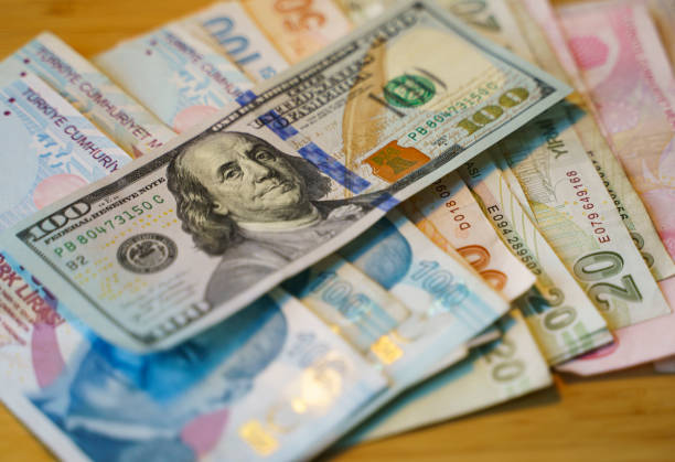 US Dollars and Turkish Lira stock photo