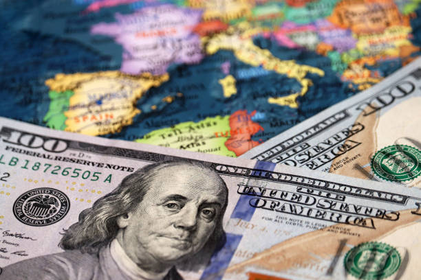 US dollars on the map of Europe Concept of trade between the United States and Europe, exchange rate, tourism, american investment in EU bond market  stock pictures, royalty-free photos & images