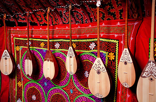 Dombra instrument in Kazakh yurt interior Dombra string instruments on the wall of Kazakh yurt at Nauryz celebration in Almaty, Kazakhstan kazakhstan stock pictures, royalty-free photos & images