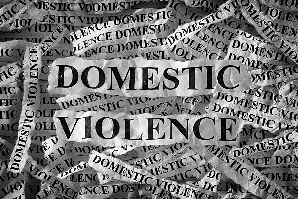 Domestic violence Domestic violence. Torn pieces of paper with the words Domestic violence. Concept Image. Black and White. Closeup. domestic violence stock pictures, royalty-free photos & images