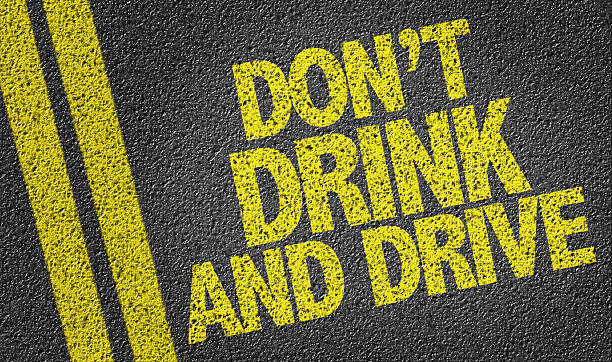 Don't Drink and Drive written on the road stock photo