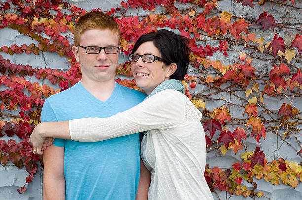 don't hug me, mom! Teen boy refuses to hug his mom back embarrassment photos stock pictures, royalty-free photos & images