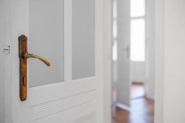door handle closup in empty apartment room or  vacant flat - stock photo