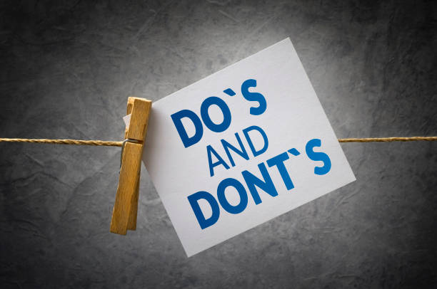 Do`s and don`ts Do`s and don`ts paper note attach to rope with clothes pins on dark background rules of interviewing stock pictures, royalty-free photos & images