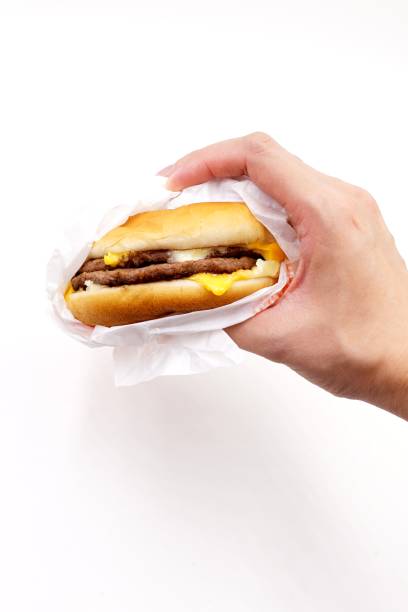 Double cheeseburger Double cheeseburger burger wrapped in paper stock pictures, royalty-free photos & images