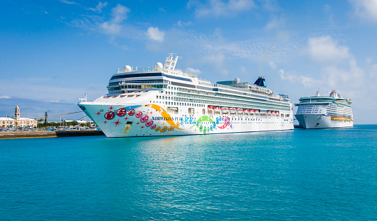 Royal Naval Dockyard, Bermuda- May 24, 2022- Two luxury cruise ships are docked at the pier at the historic Royal Naval Dockyard.  The 
