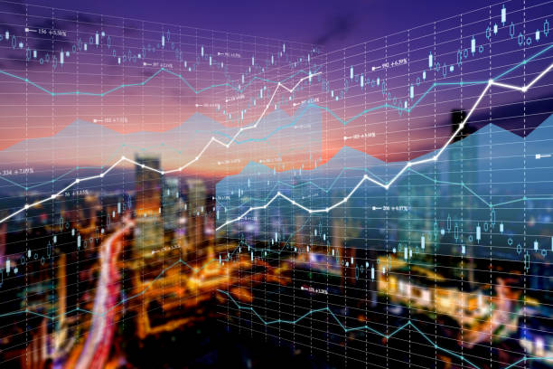 Double exposure business technology and abstract financial charts in sky on city background. Business information concept stock photo