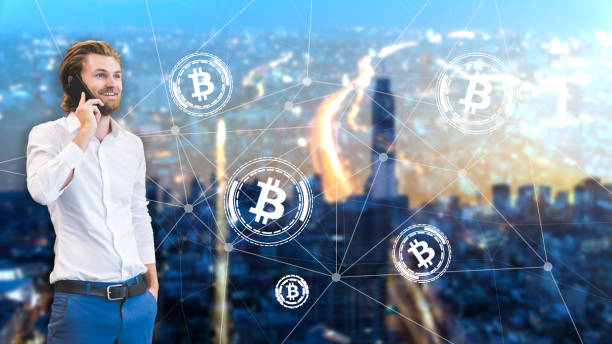 Double exposure of business man talking about bitcoin with bitcoin icons and city scape background. stock photo
