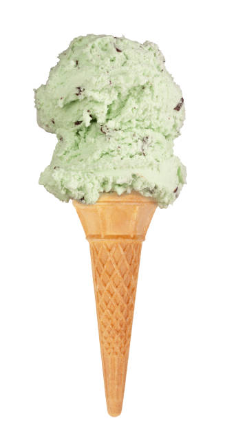 Double scoop of mint choc chip ice cream on a waffle cone stock photo