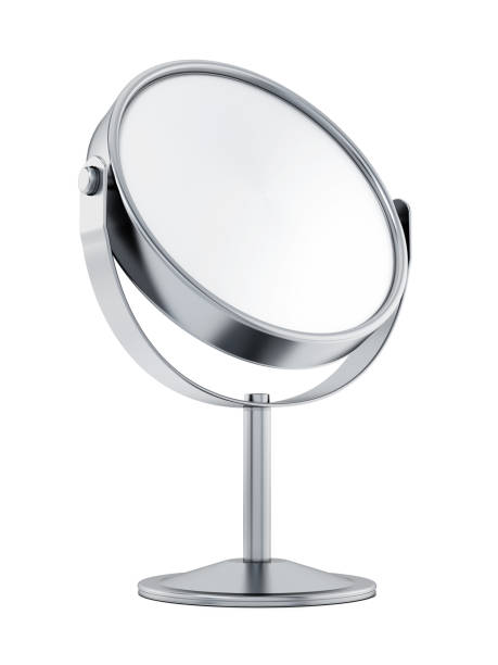 Double sided silver magnifying mirror Silver magnifying mirror isolated on white. mirror object stock pictures, royalty-free photos & images