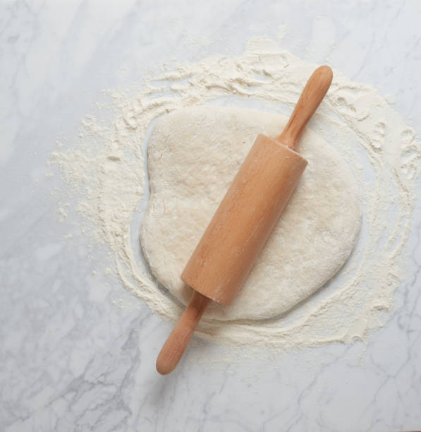 Dough and rolling pin stock photo