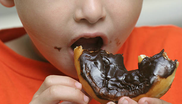 Doughnut eater stock photo