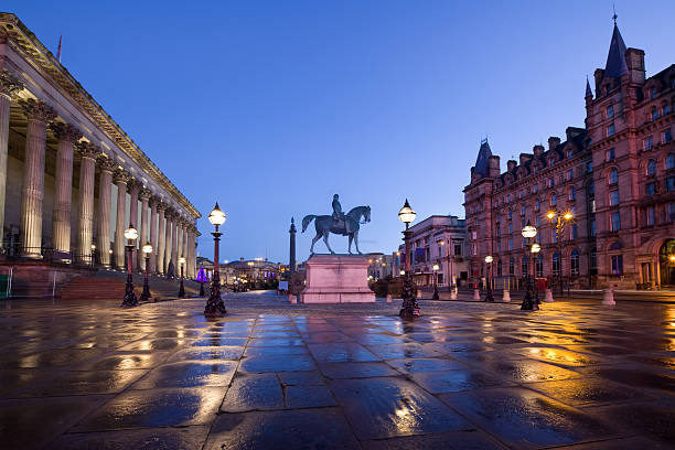 Downtown Liverpool England UK St Georges Plateau St George's Plateau in central Liverpool with the equestrian statue of Prince Albert and St George's Hall on the left side at dawn. liverpool england stock pictures, royalty-free photos & images