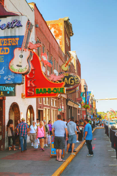 Downtown Nashville with people NASHVILLE - AUGUST 28: Downtown Nashville with people at night on August 28, 2015 in Nashville, TN. Nashville is the capital of the State of Tennessee and the county seat of Davidson County. broadway nashville stock pictures, royalty-free photos & images