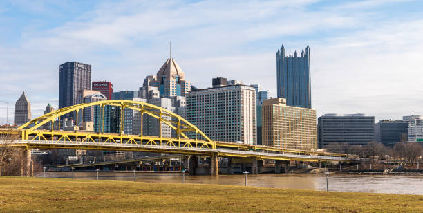 Downtown Pittsburgh, Pennsylvania, USA with the Fort Pitt Bridge spanning across the Allegheny River stock photo