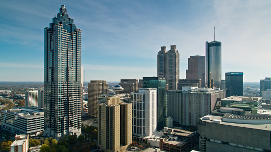 Aerial shot of hotels and office towers in Peachtree Center in Downtown Atlanta, Georgia on a sunny afternoon in Fall.