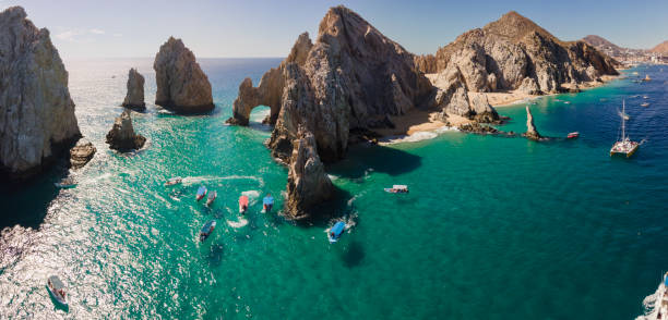 Downward Looking Aerial of the shallow water in Cabo San Lucas, Baja California Sur, Mexico near the Darwin Arch glass bottom boats viewing sealife stock photo