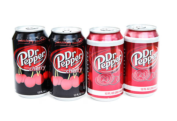 Dr Pepper sodas "West Palm Beach, USA - September 3, 2012: This is a studio product shot of two Dr Pepper Cherry and two Dr Pepper regular sodas made by Pepsico Company." doctor pepper soda stock pictures, royalty-free photos & images
