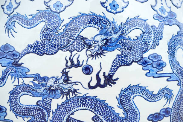 Dragon. A beautiful dragon pattern on a Chinese water jar. This is a common pattern and massively produced in Thailand and China. Dragon. A beautiful dragon pattern on a Chinese water jar. This is a common pattern and massively produced in Thailand and China. porcelain stock pictures, royalty-free photos & images