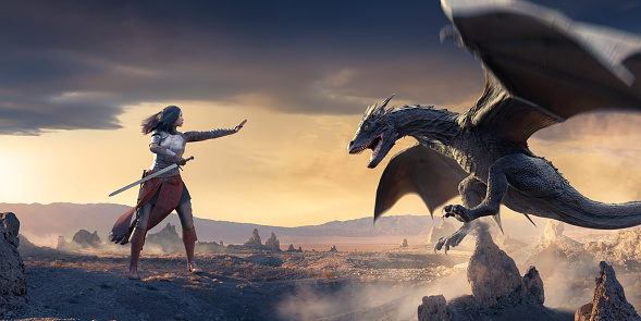 A dragon in mid flight, with motion blur to the wings hovering close to some rocks in an arid landscape with small jagged rock formations. A female knight in armour and leather stand holding a sword backward in one hand and the other hand outstretched towards the dragon.