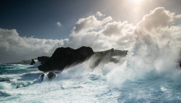 Dramatic big ocean waves crash on cliffs during typhoon in Okinawa stock photo