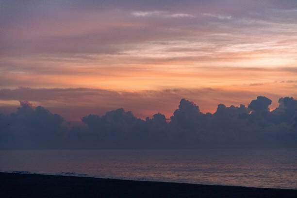 Photo of Dramatic Clouds at Sunrise over the Ocean