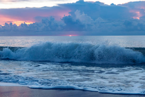Photo of Dramatic Clouds at Sunrise over the Ocean