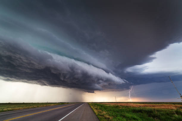 Dramatic dark sky ahead of an approaching supercell thunderstorm. Dramatic dark clouds and sky ahead of a powerful supercell thunderstorm approaching Lamar, Colorado. approaching stock pictures, royalty-free photos & images