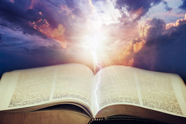 Dramatic sky with open Bible Dramatic sky with open Bible apocalypse stock pictures, royalty-free photos & images