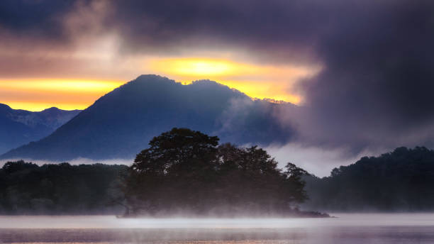 Dramatic sunrise over foggy lake Hibara, Japan stock photo