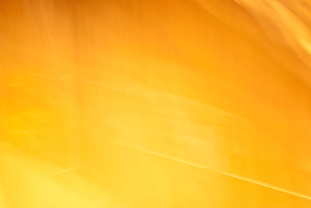 Dramatic yellow-orange light texture or background stock photo
