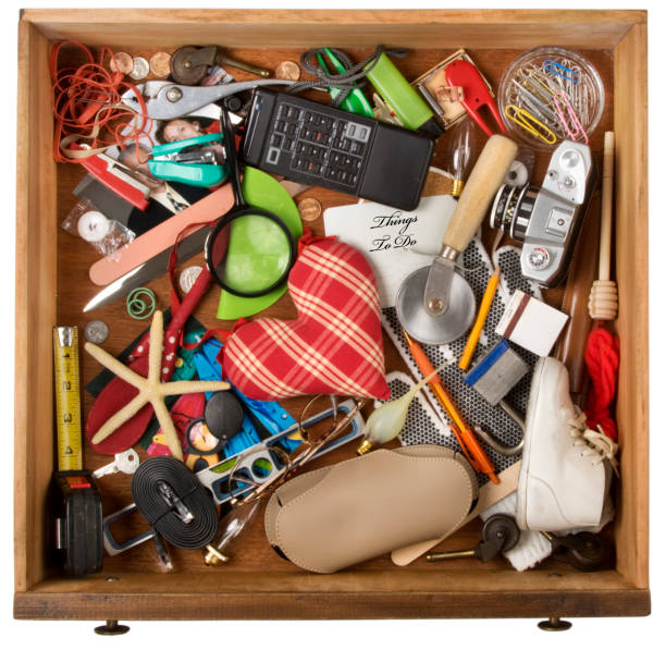 Drawer  of junk, of various household items. Isolated on a white background with clipping path Dresser drawer that catches all the miscellaneous stuff that we all have. Image shot with Canon Rebel T6s 24 Megapixel DIGIC 6, 24-105mm f/4L IS USM lens, 100 ISO.. obsolete stock pictures, royalty-free photos & images