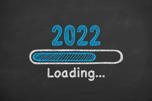 Drawing Loading New Year 2022 on Blackboard Background stock photo
