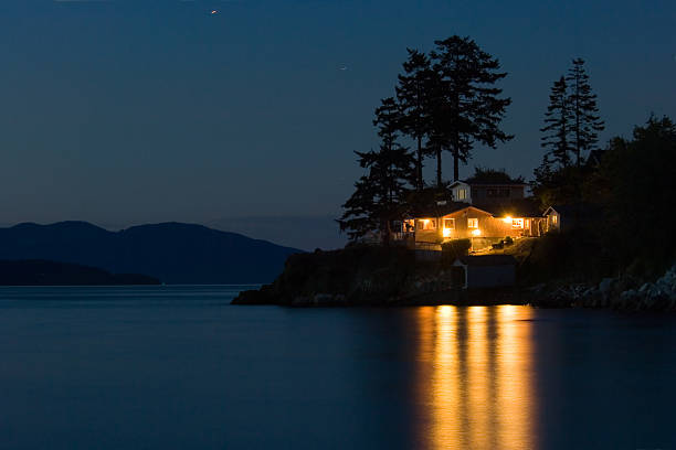 Dream house Lighted house on Pacific coast, Washington state waterfront stock pictures, royalty-free photos & images