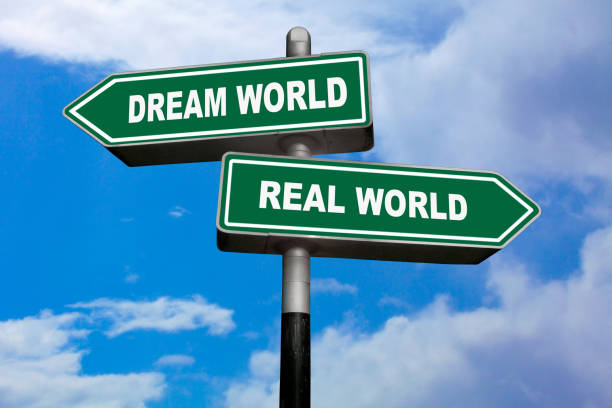 Dream world vs Real world - Direction signs stock photo