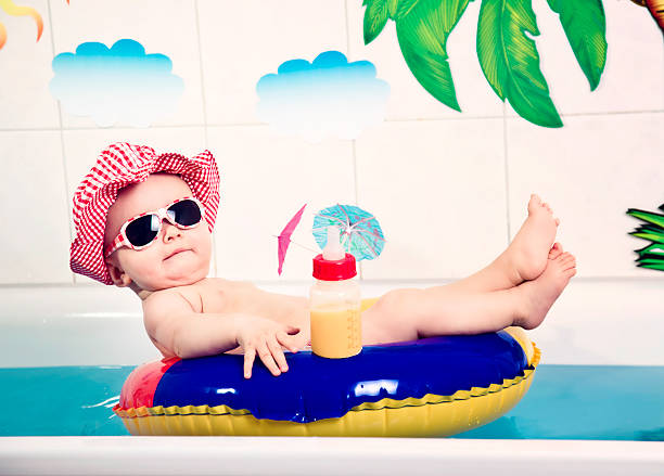dreaming of vacation - swimming baby stockfoto's en -beelden