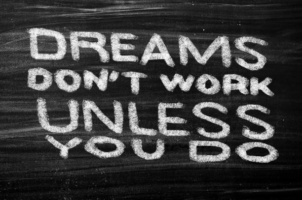Dreams Don't Work Unless You Do. Inspiring Creative Motivation Quote stock photo