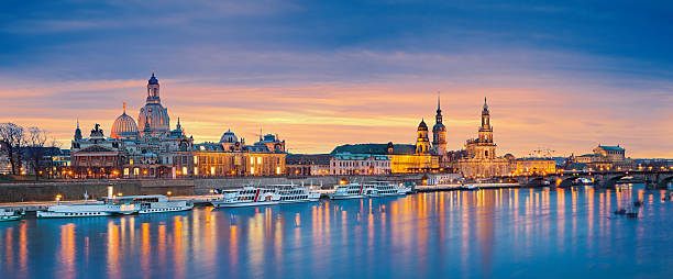 Dresden. Panoramic image of Dresden, Germany during sunset with Elbe River in the foreground. This is composite of two horizontal images stitched together in photoshop. elbe river stock pictures, royalty-free photos & images
