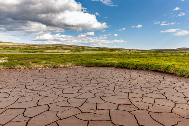 Dried out soil in a lake stock photo
