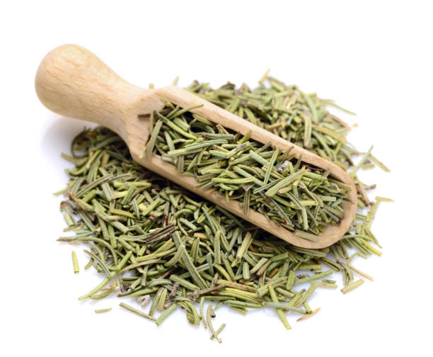 Dried Rosemary in a scoop for spices stock photo