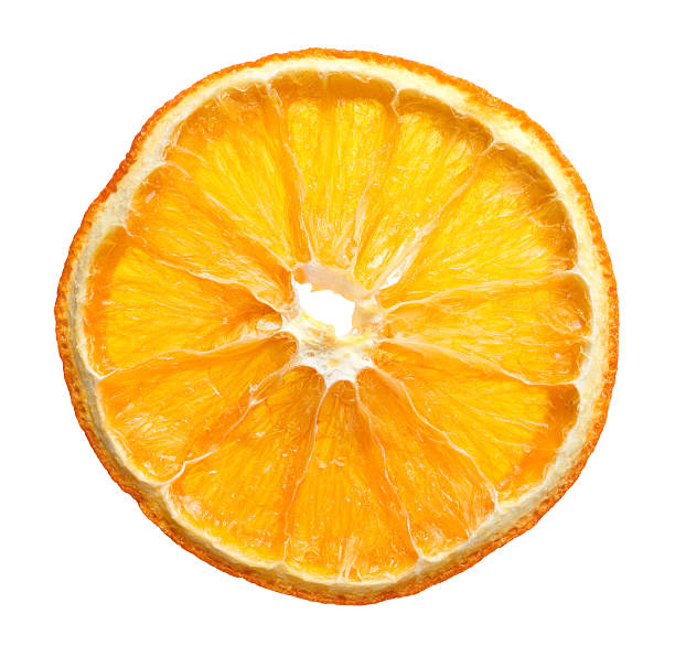 dried slice of orange dried slice of orange over white background dried food photos stock pictures, royalty-free photos & images