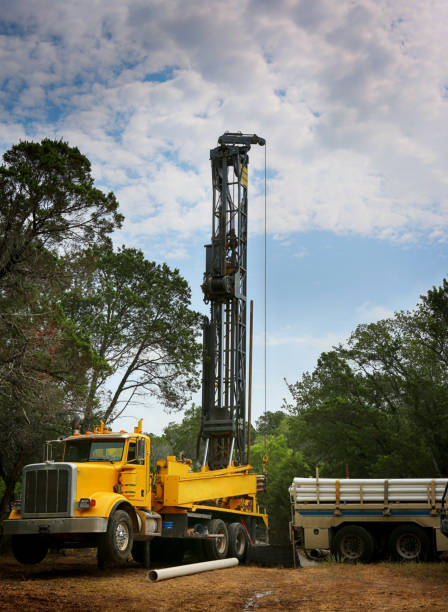 Drilling a water well on country land. Modern rotary drill rigs bore water well. drill stock pictures, royalty-free photos & images