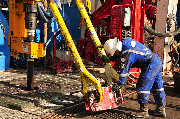 Drilling rig worker stock photo