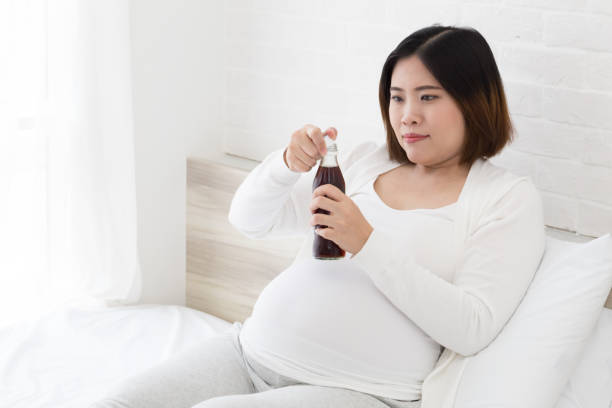 Drink cola during pregnancy, Pregnant women should not drink caffeine beverage Drink cola during pregnancy, Pregnant women should not drink caffeine beverage caffeine pregnancy stock pictures, royalty-free photos & images