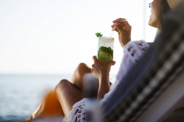 Drinking cocktail on the beach! stock photo