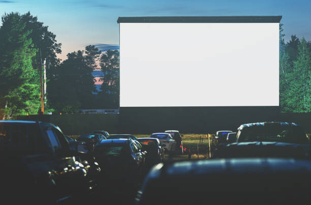 Drive In Movie Movie goers enjoy a drive in movie for the first time in 2020. Long exposure. film industry photos stock pictures, royalty-free photos & images