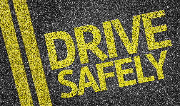 Drive Safely written on the road stock photo