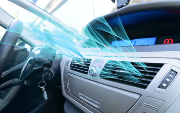 Driver hand tuning air ventilation grille stock photo