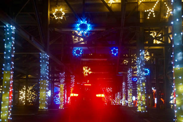 Drive-thru Christmas lights display at night stock photo