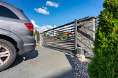 istock Driveway with an automatic gate 1347501798